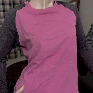 Lululemon Long sleeve, ball shirt. Pink and gray. Thumb holes. Size 10. No tag.